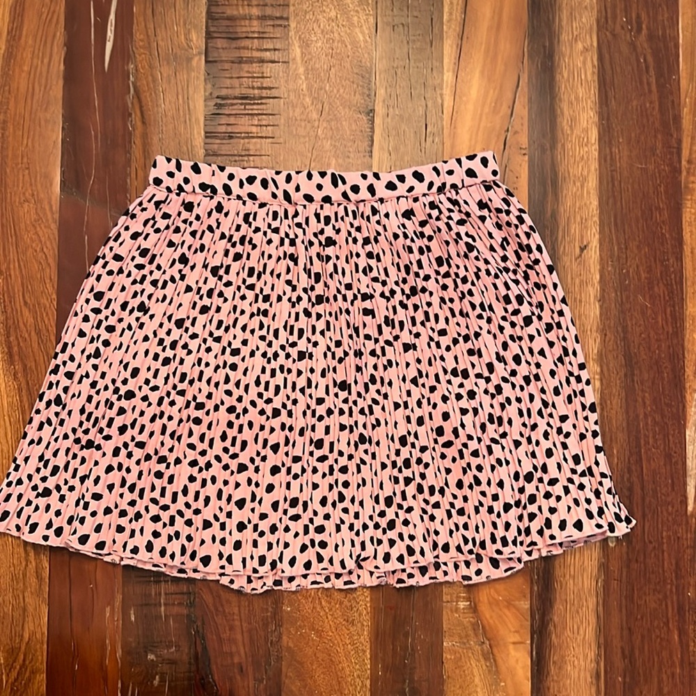Brand new, without tags, pink and black polka dotted girls’ skirt